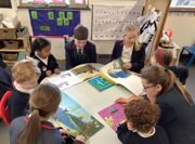 Yr 6's reading with Yr R